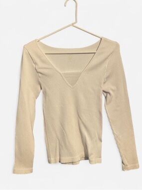 White long sleeve top with a V neckline